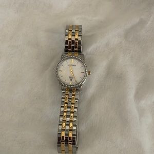 Ladies citizens gold and stainless steel watch with Crystal bezil